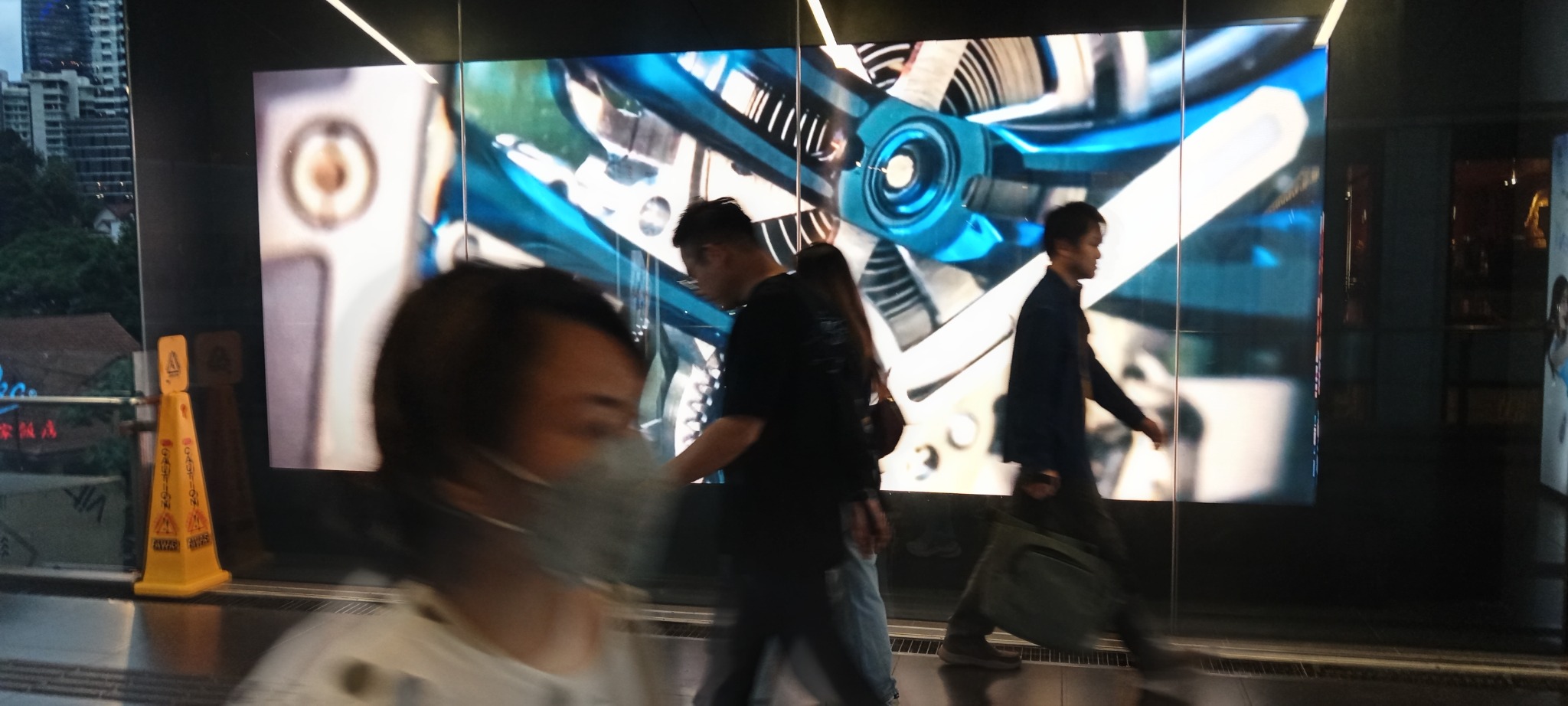 Technology display and pedestrians at Pavilion Kuala Lumpur