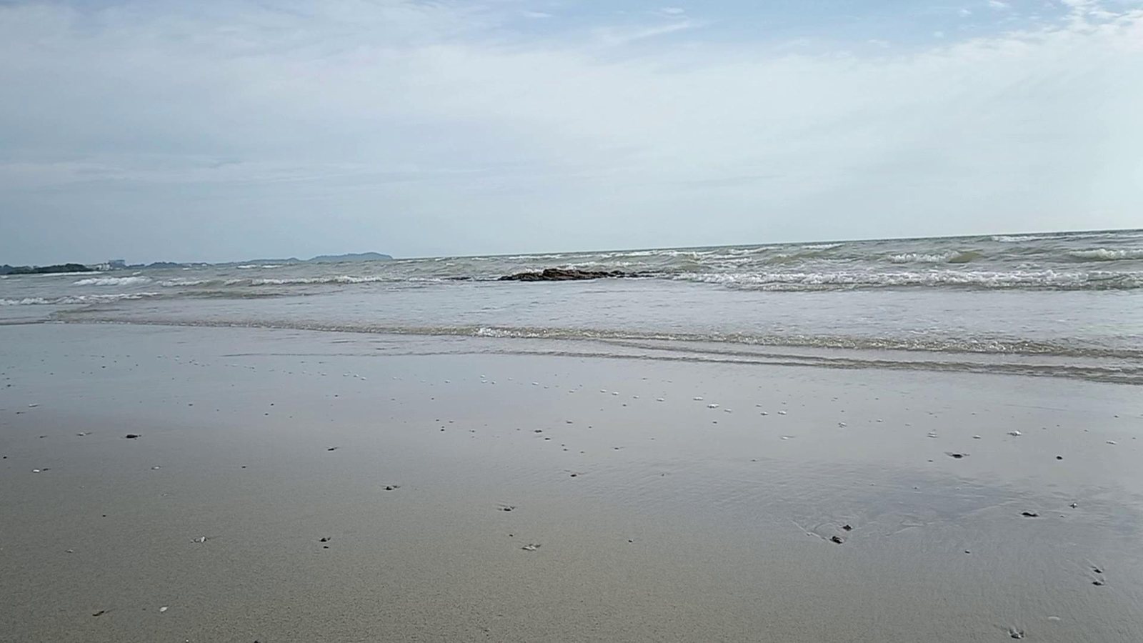 The Straits of Malacca beneath a wide sky