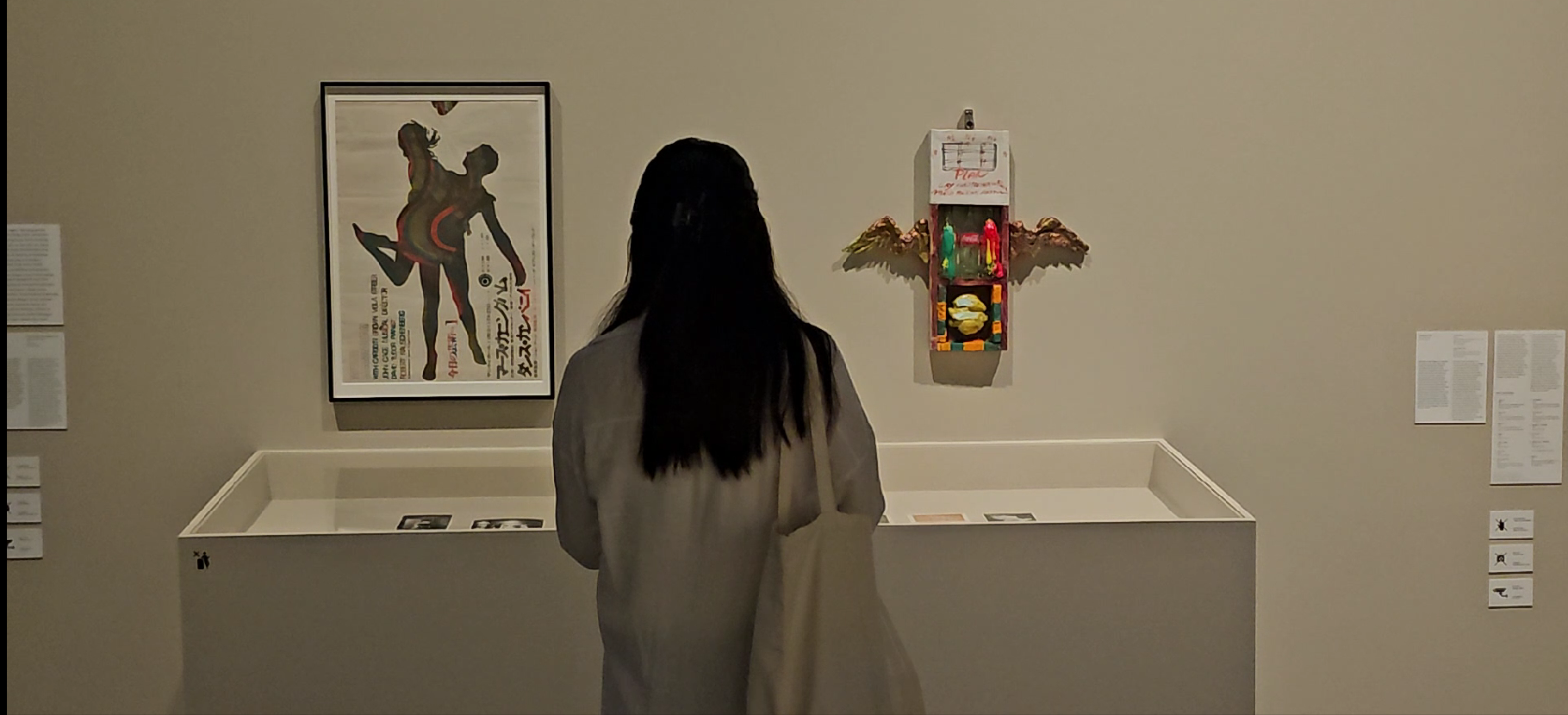 A visitor encountering artworks at an exhibition in Kuala Lumpur