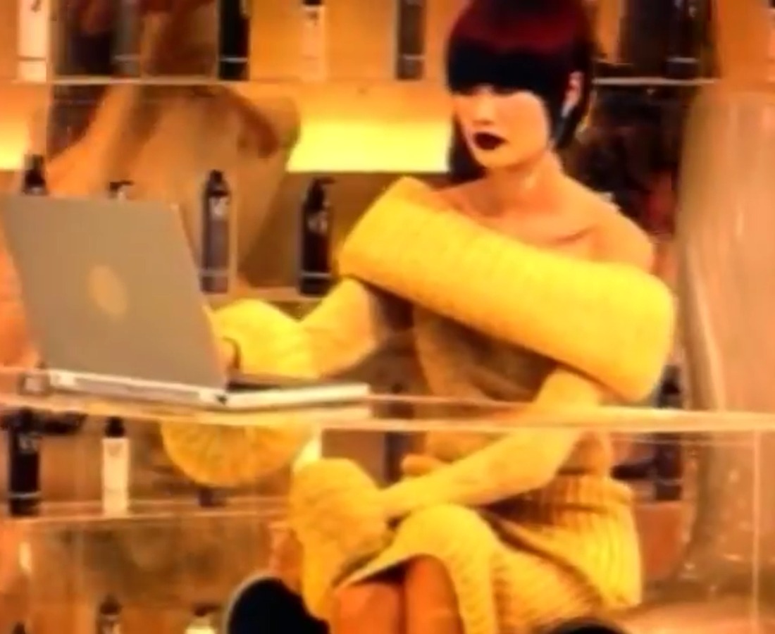 Archival frame from a Vidal Sassoon commercial showing the receptionist at her desk
